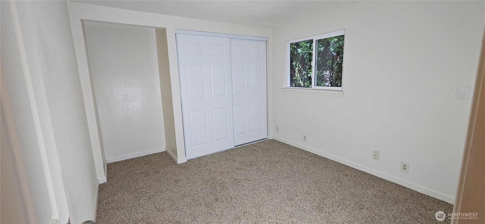 7606 Union Mills Road Southeast Lacey, WA 98503 - Photo 10 of 16 an empty room with a window