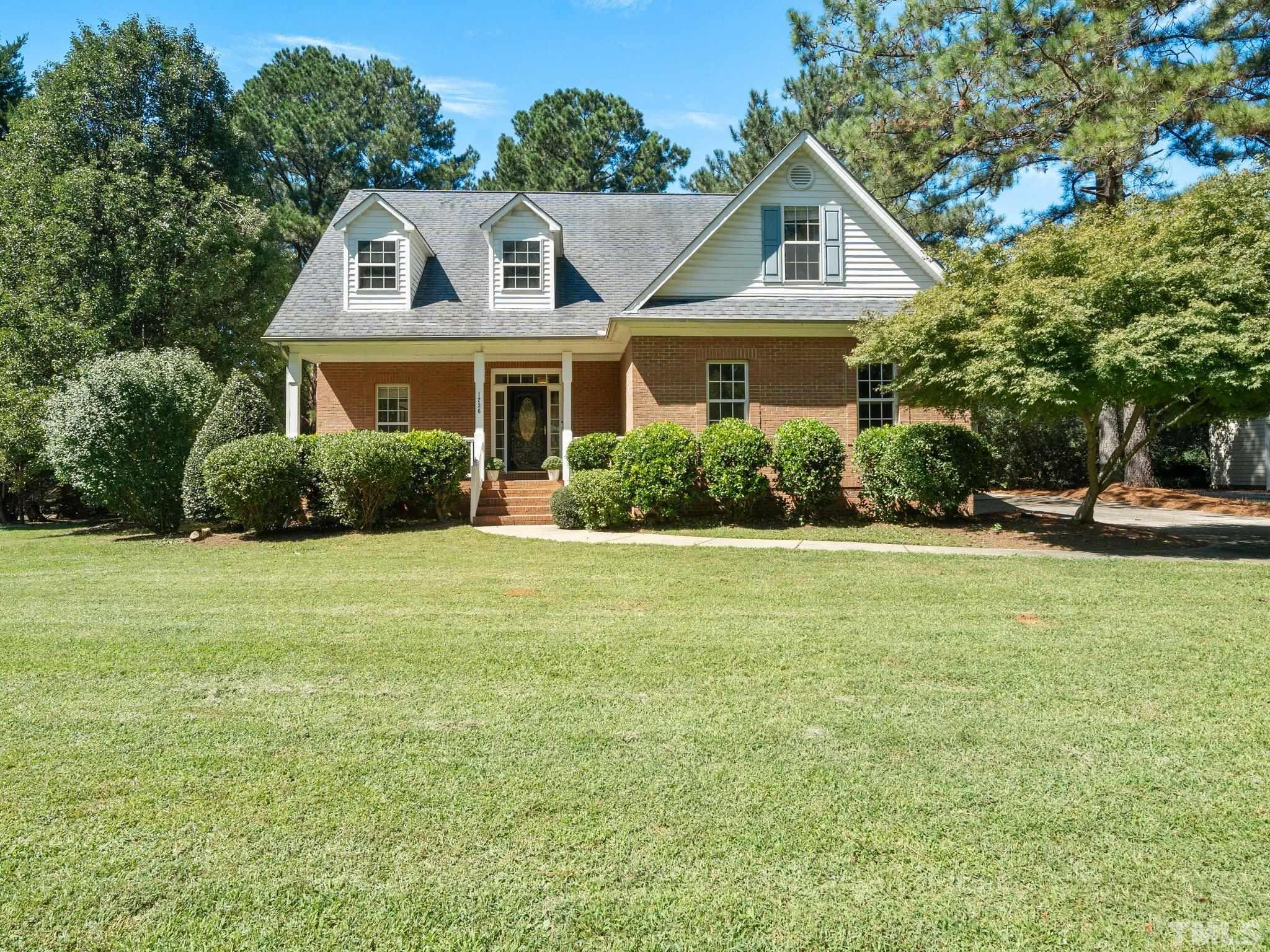 1236 Torchlight Way Raleigh, NC 27603 - Photo 1 of 39 a front view of a house with a yard