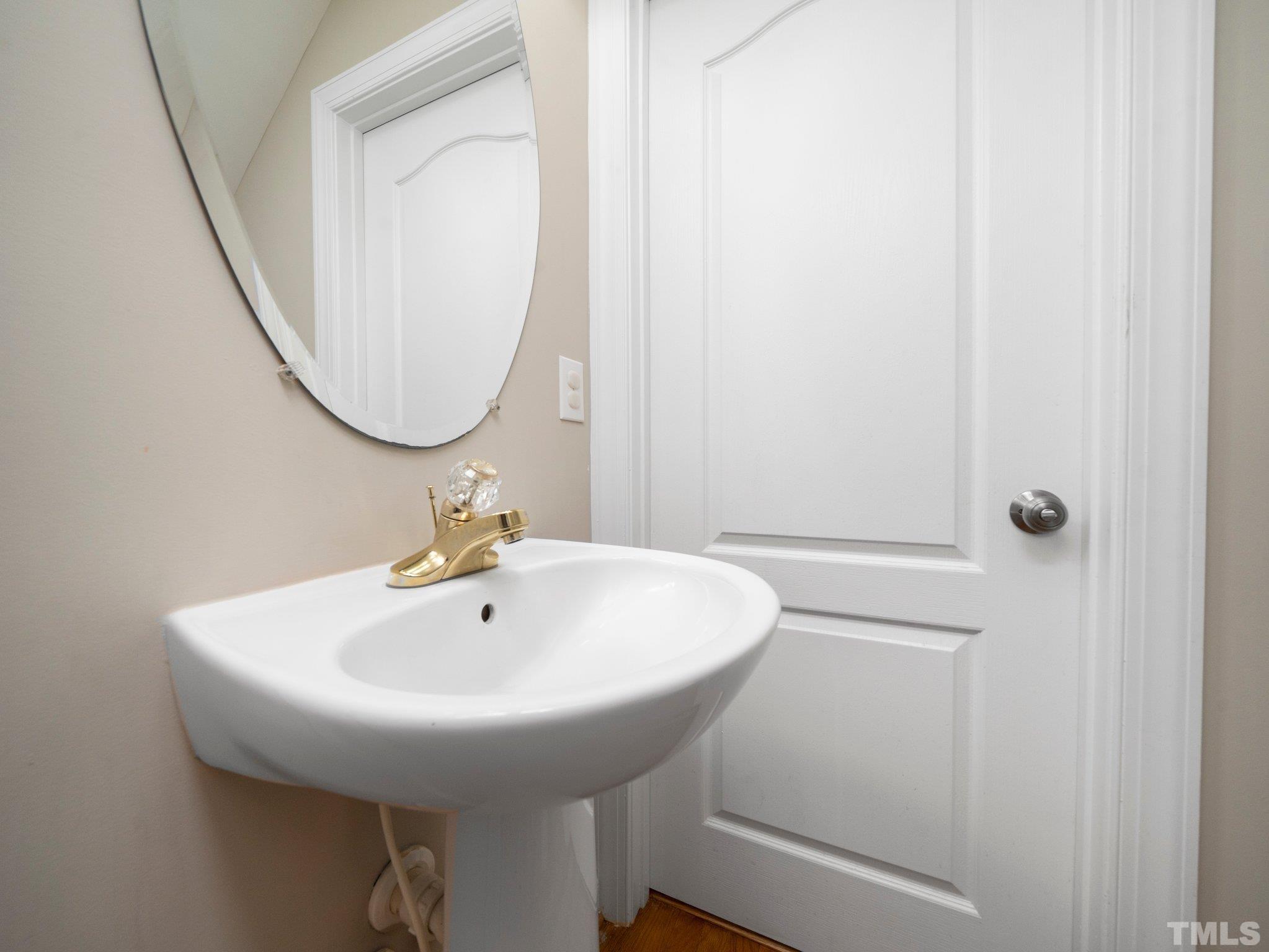 1236 Torchlight Way Raleigh, NC 27603 - Photo 15 of 39 a bathroom with a sink and a mirror