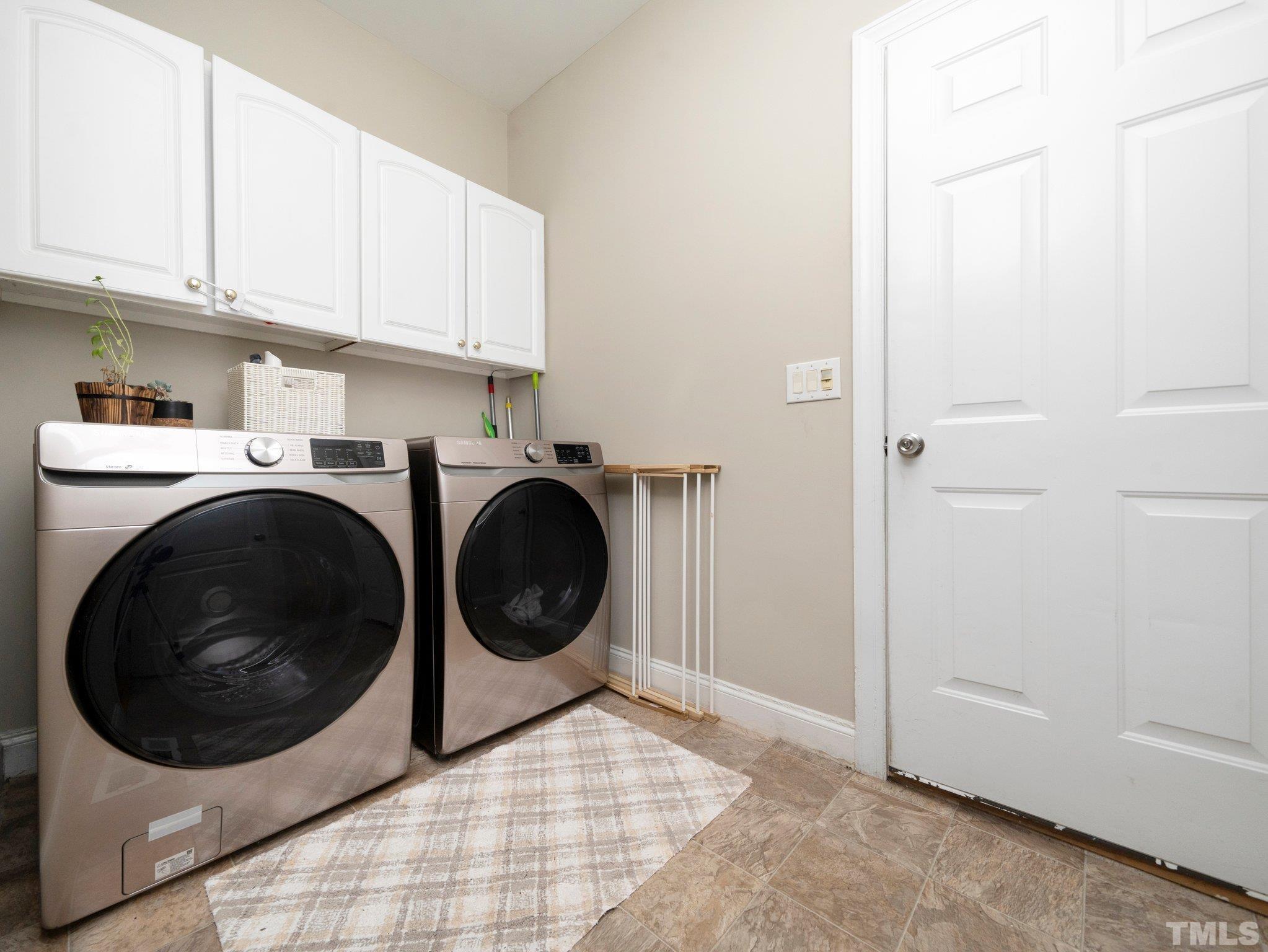 1236 Torchlight Way Raleigh, NC 27603 - Photo 21 of 39 a utility room with dryer and washer