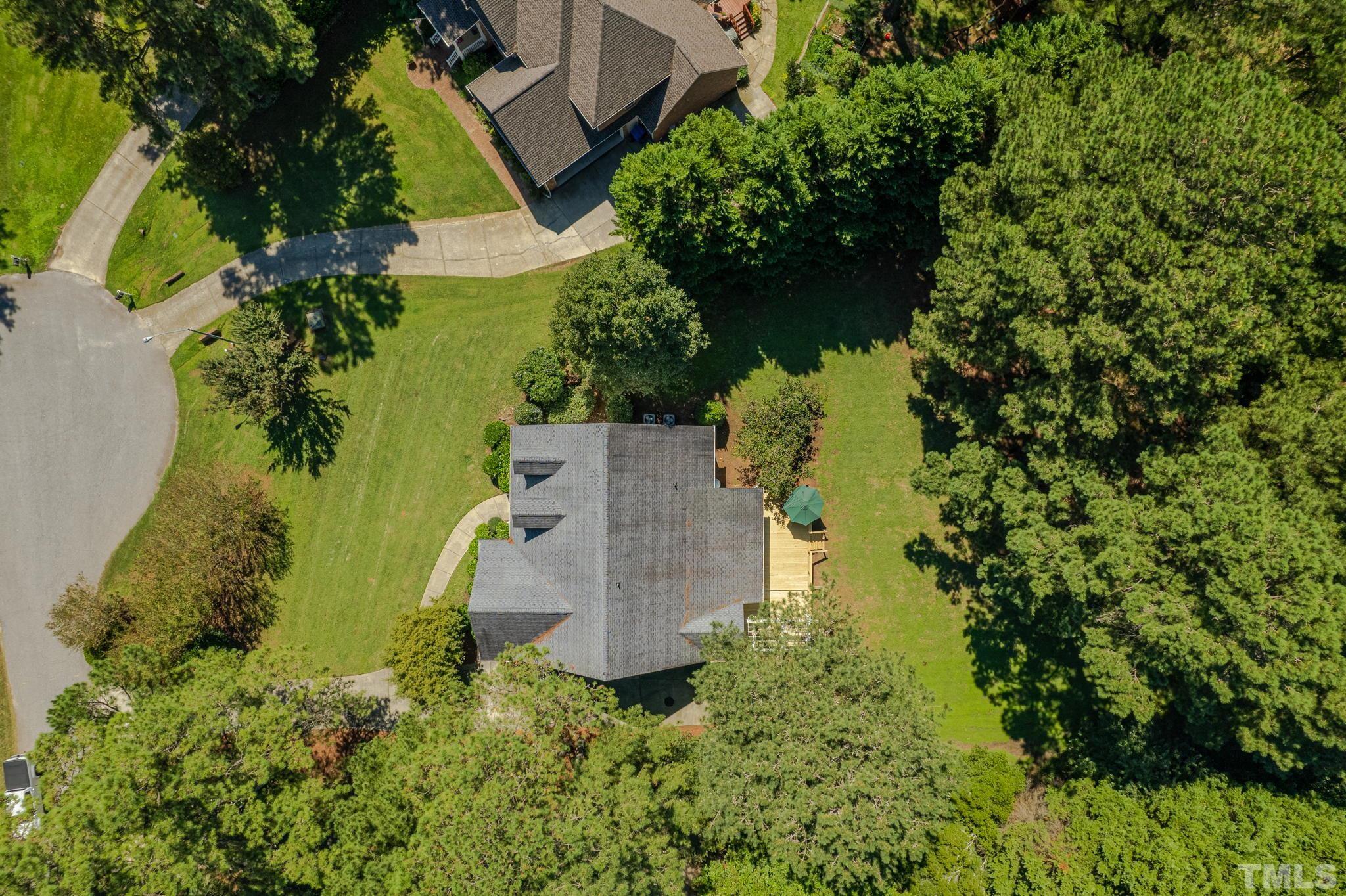 1236 Torchlight Way Raleigh, NC 27603 - Photo 32 of 39 an aerial view of a house with a yard and large trees