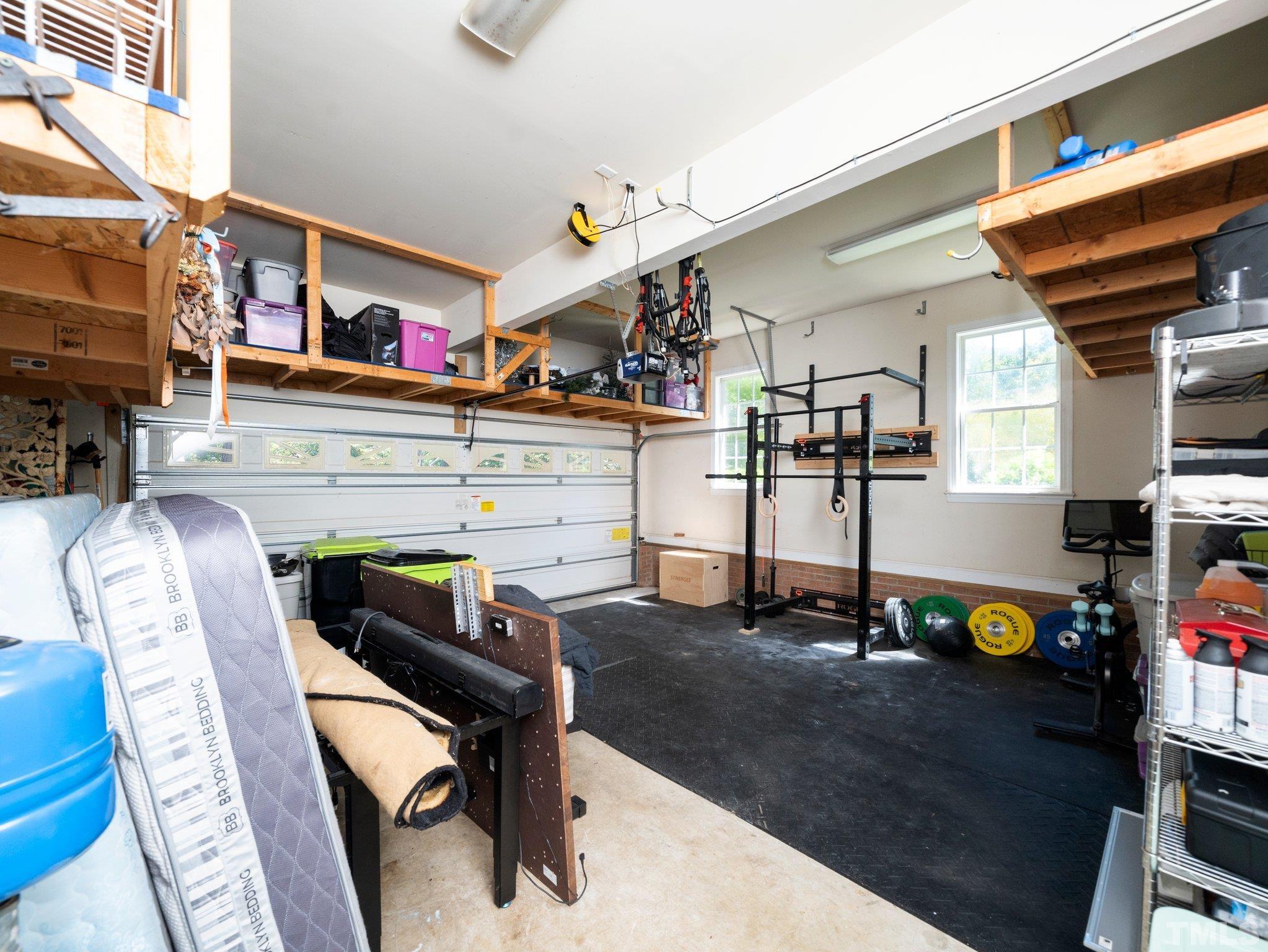 1236 Torchlight Way Raleigh, NC 27603 - Photo 39 of 39 a work room with furniture and a flat screen tv