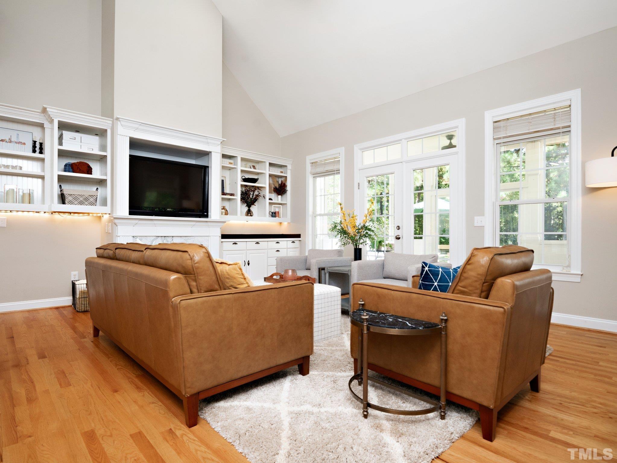 1236 Torchlight Way Raleigh, NC 27603 - Photo 5 of 39 a living room with furniture and a flat screen tv