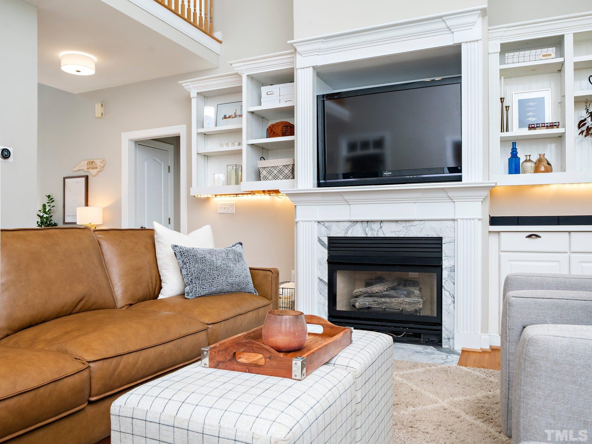 1236 Torchlight Way Raleigh, NC 27603 - Photo 6 of 39 a living room with furniture and a fireplace
