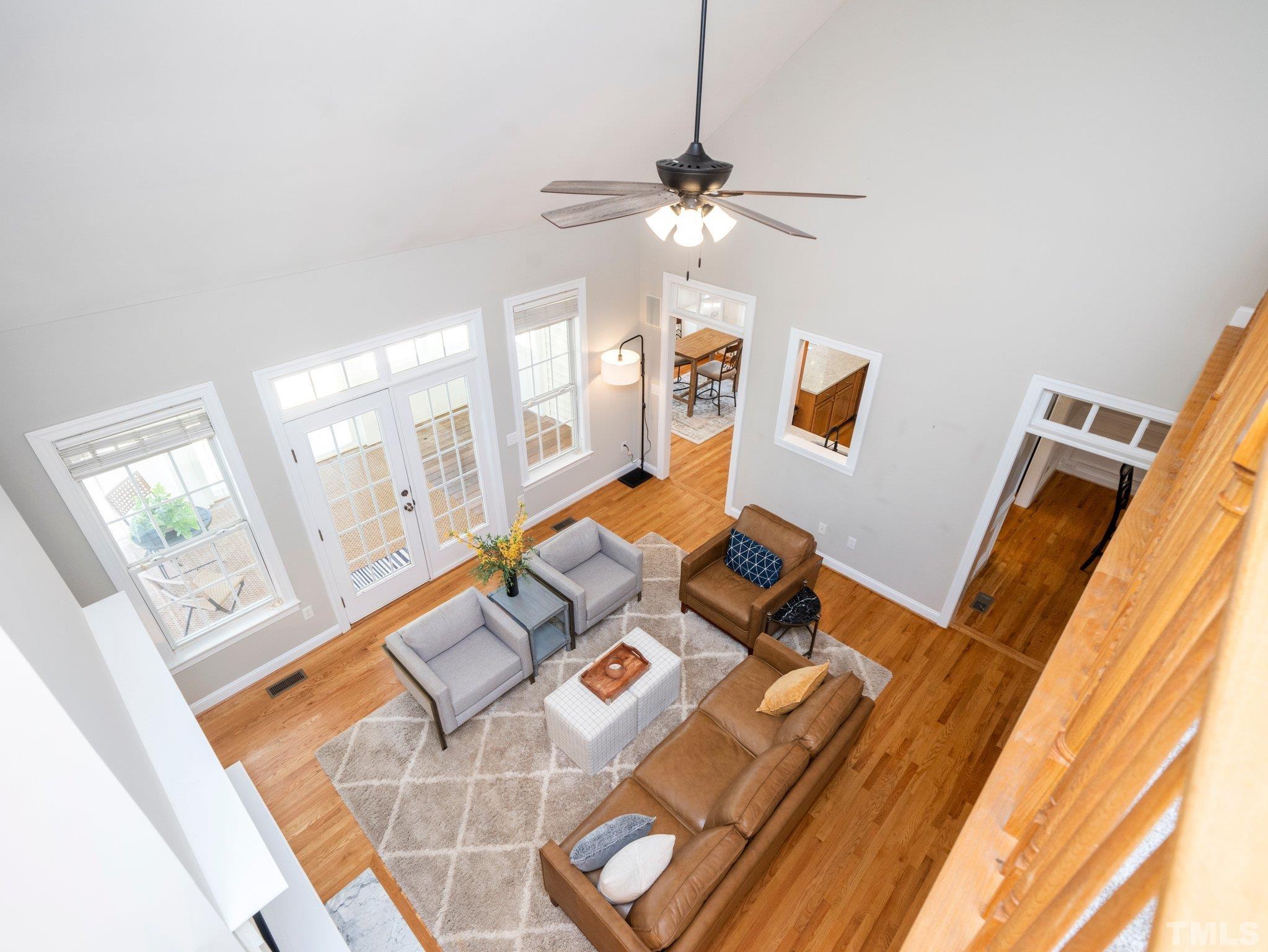 1236 Torchlight Way Raleigh, NC 27603 - Photo 8 of 39 a living room with furniture and a flat screen tv