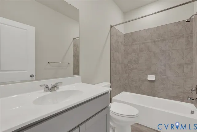 a bathroom with a sink a toilet and a bathtub