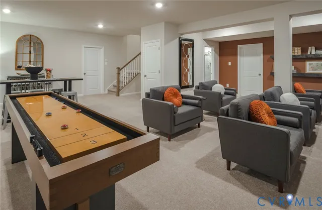 a living room with furniture pool and a table