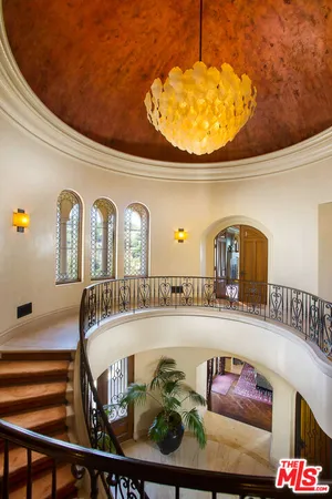 a view of an chairs and tables in the balcony