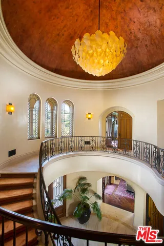 a view of an chairs and tables in the balcony