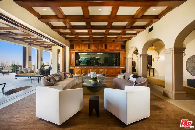 a bedroom with a large bed and a large window