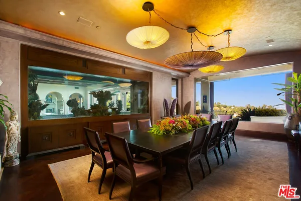 a view of a swimming pool with a couches in a patio