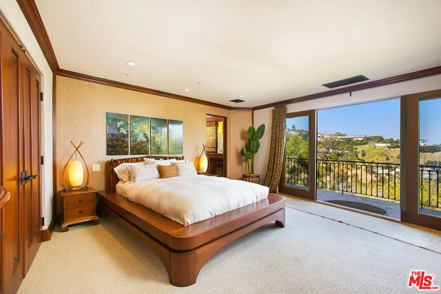 a view of a chairs and table in a balcony