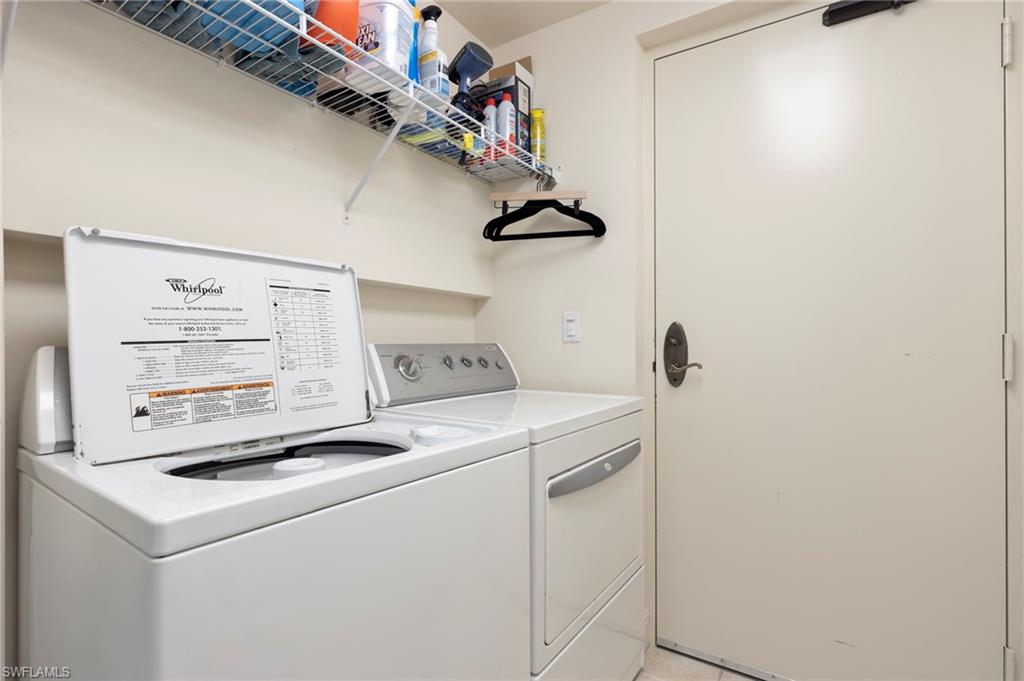 1065 Borghese Lane, Unit 403 Naples, FL 34114 - Photo 11 of 30 a utility room with dryer and washer