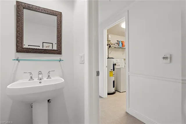a bathroom with a sink and mirror