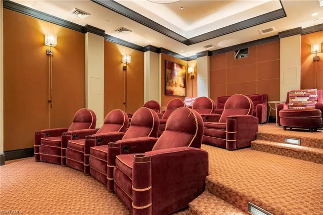 a swimming pool with a yard and palm trees