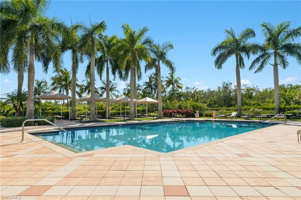 1065 Borghese Lane, Unit 403 Naples, FL 34114 - Photo 28 of 30 a view of a swimming pool and lounge chair