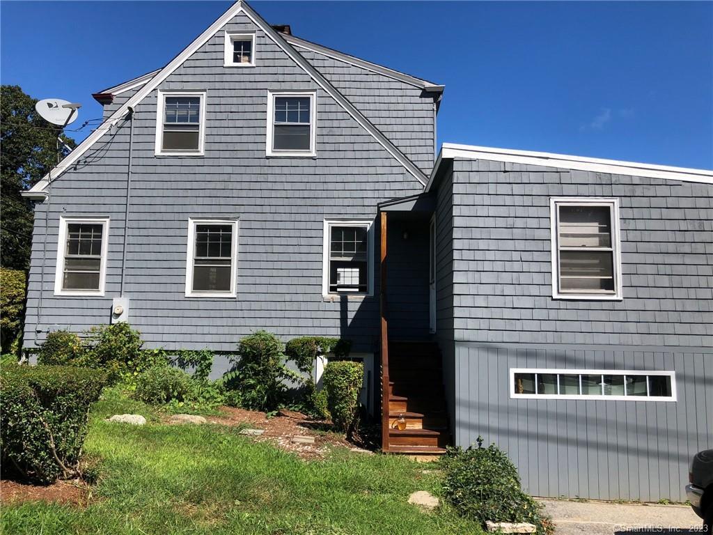 664 Noank Road Groton, CT 06355 - Photo 1 of 1 a front view of a house with a yard