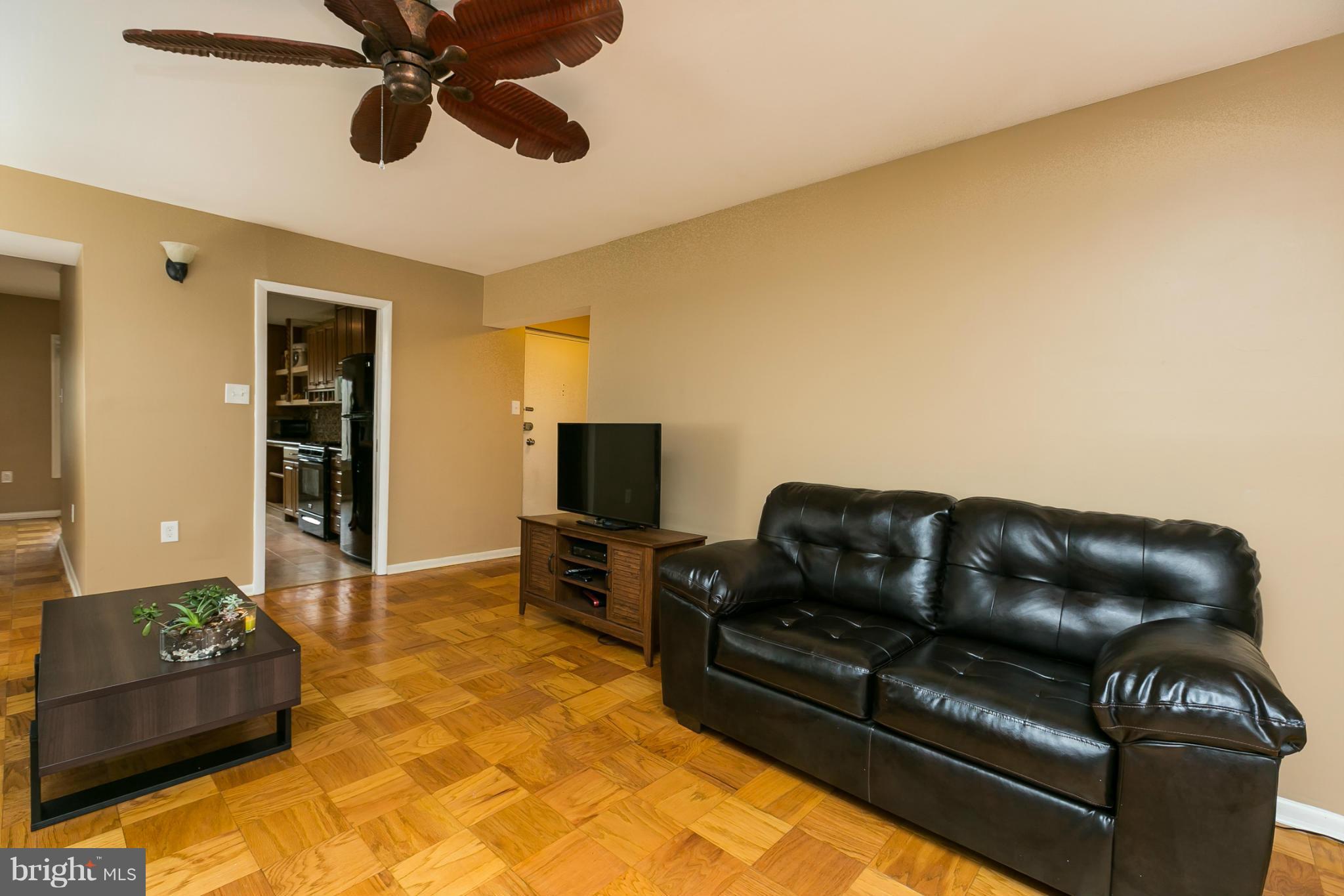 5235 West Running Brook Road, Unit 302 Columbia, MD 21044 - Photo 13 of 29 a living room with furniture and a flat screen tv