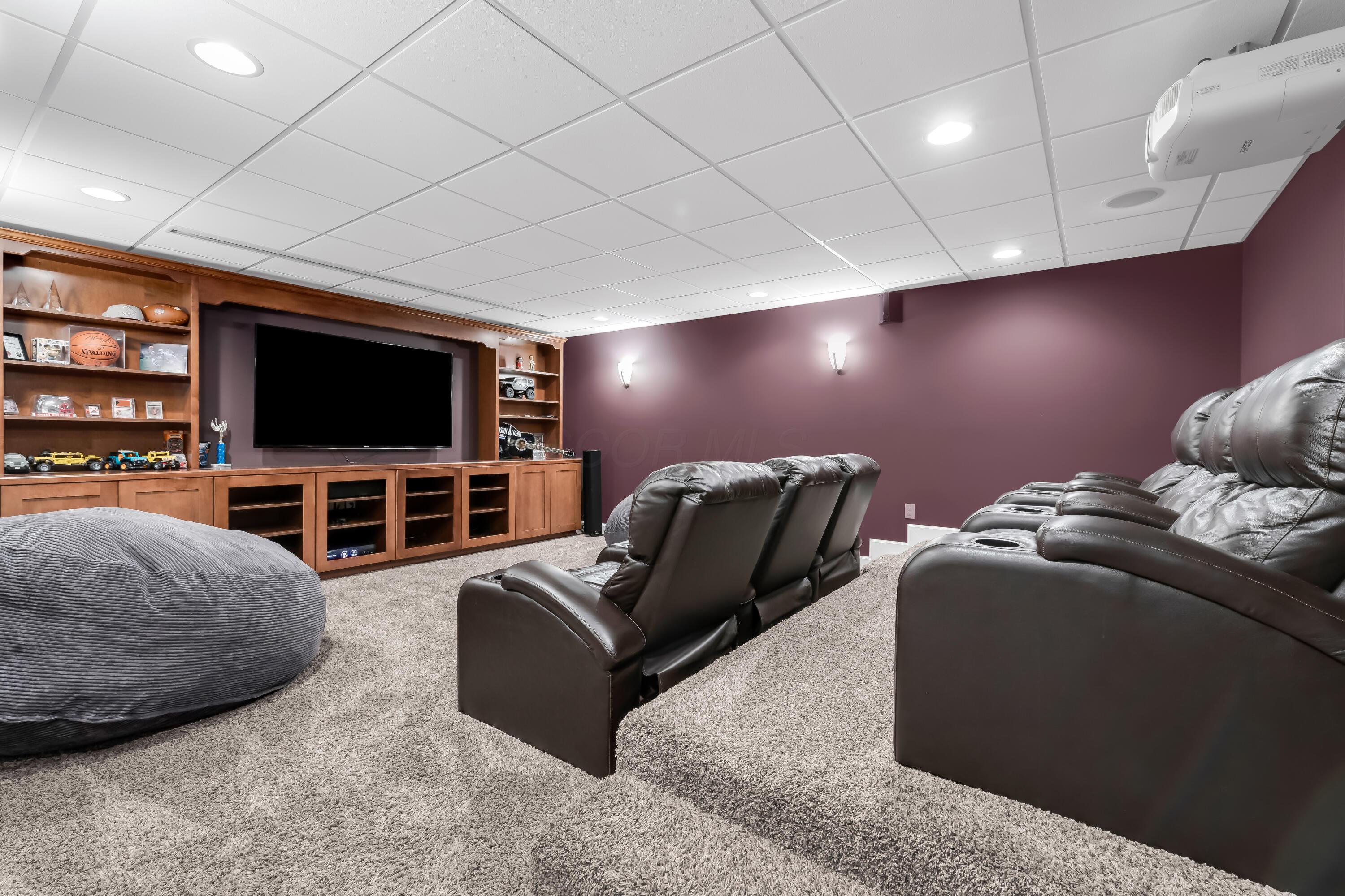 16689 Bailor Road Laurelville, OH 43135 - Photo 41 of 73 • Light sand carpet
• Plum painted walls
• Platform with seating
• Acoustic ceiling tiles
• Seating is negotiable
• Projector & screen remains
• Built-in entertainment unit
• TV is negotiable
• Mount remains
• Lighted wall sconces
• Speakers are negotiable