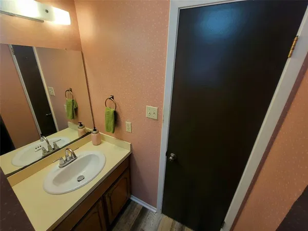 a bathroom with a sink and a mirror