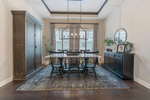 a view of dining room with furniture and window