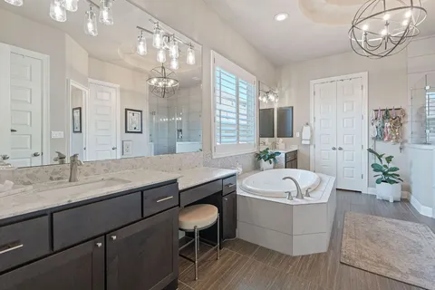 a spacious bedroom with a bed and a window