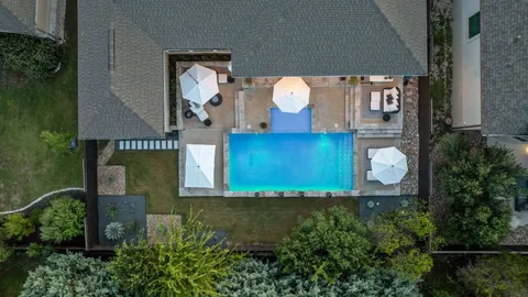 a kitchen with stainless steel appliances a cabinets and wooden floor
