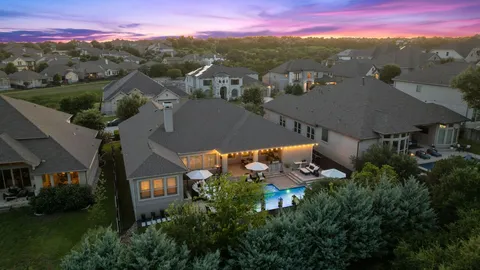 a view of swimming pool with sitting area