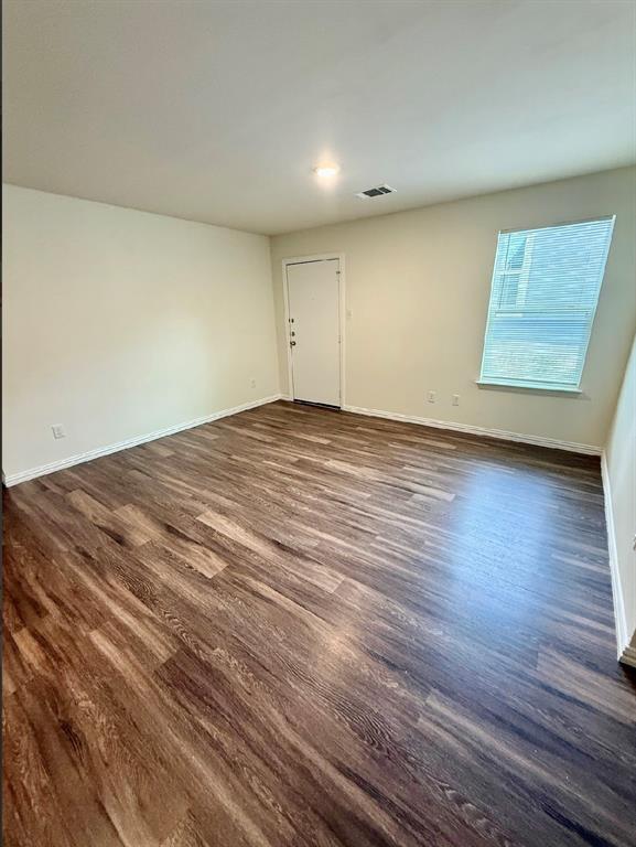 812 South 22nd Street Temple, TX 76501 - Photo 16 of 34 a view of empty room with wooden floor and fan