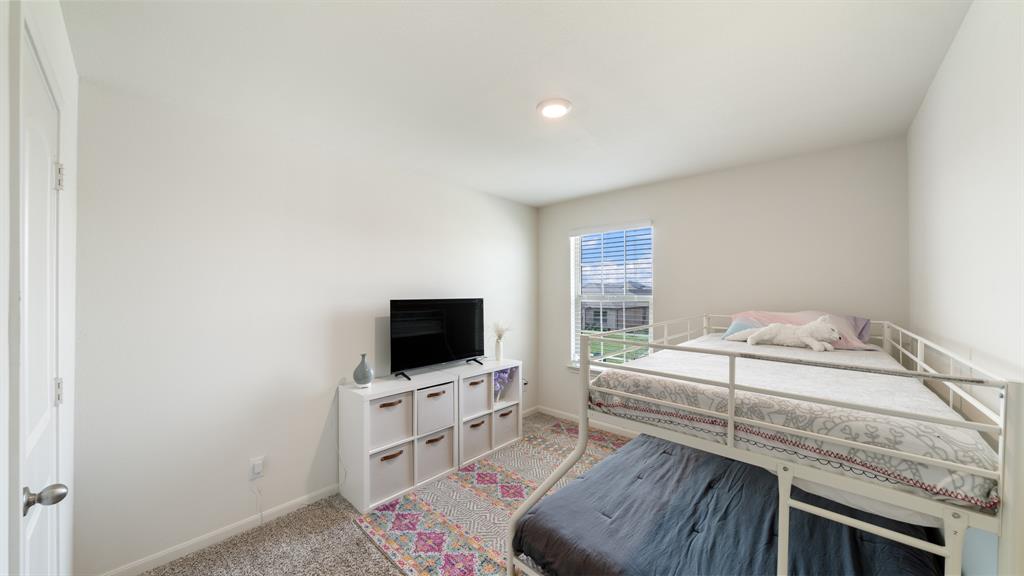 408 Micah Lane Ferris, TX 75125 - Photo 13 of 19 a living room with furniture and a flat screen tv