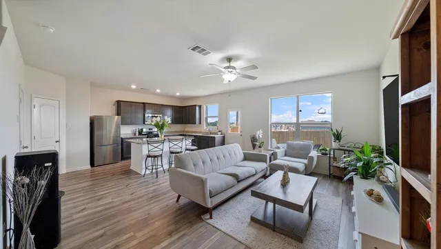 a living room with furniture fireplace and a flat screen tv