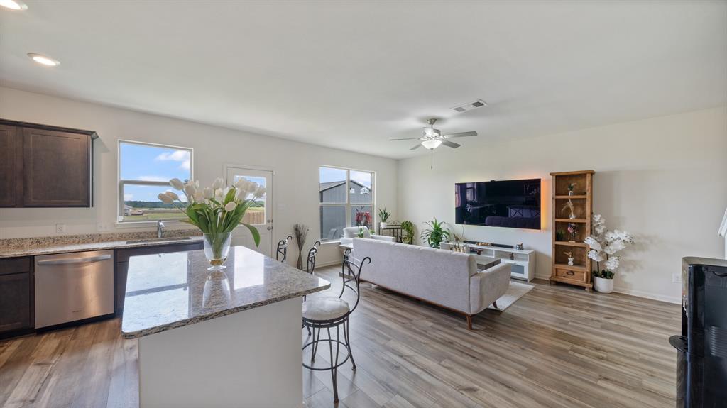 408 Micah Lane Ferris, TX 75125 - Photo 3 of 19 a living room with furniture flat screen tv and wooden floor