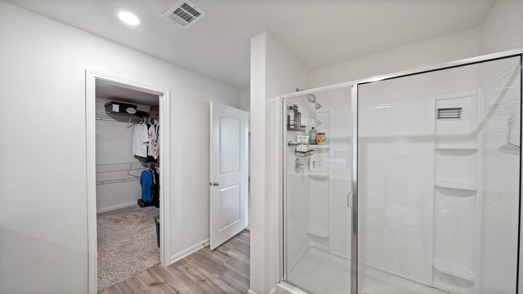 408 Micah Lane Ferris, TX 75125 - Photo 10 of 19 a bathroom with a shower and a glass door