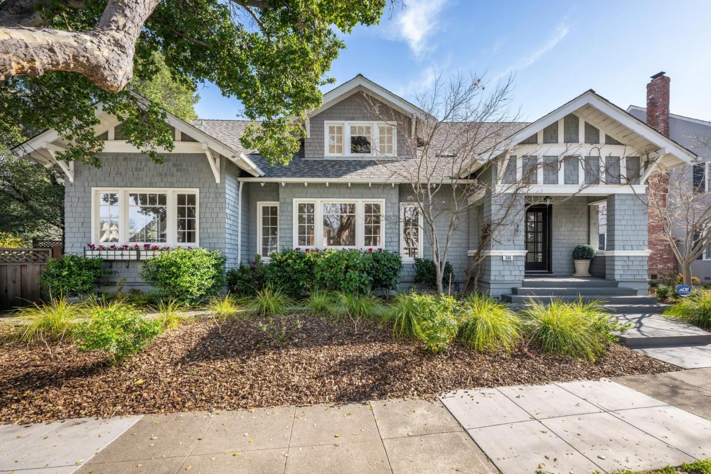 344 Occidental Avenue Burlingame, CA 94010 - Photo 1 of 27 a front view of a house with a yard and potted plants