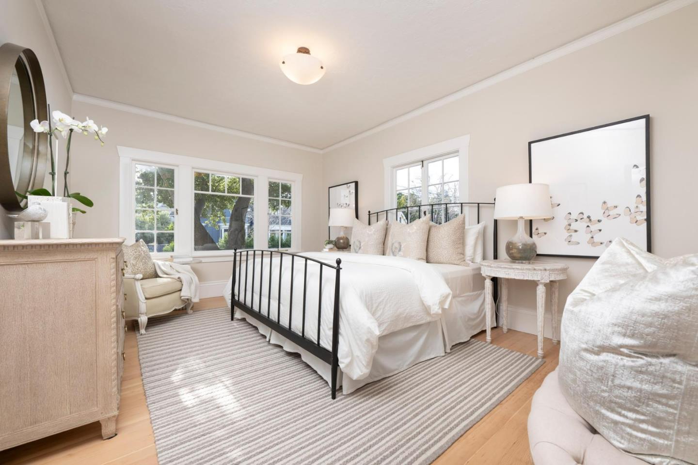 344 Occidental Avenue Burlingame, CA 94010 - Photo 12 of 27 a spacious bedroom with a bed and a large window