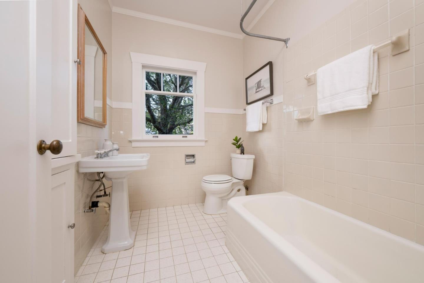 344 Occidental Avenue Burlingame, CA 94010 - Photo 13 of 27 a bathroom with a sink a toilet and shower