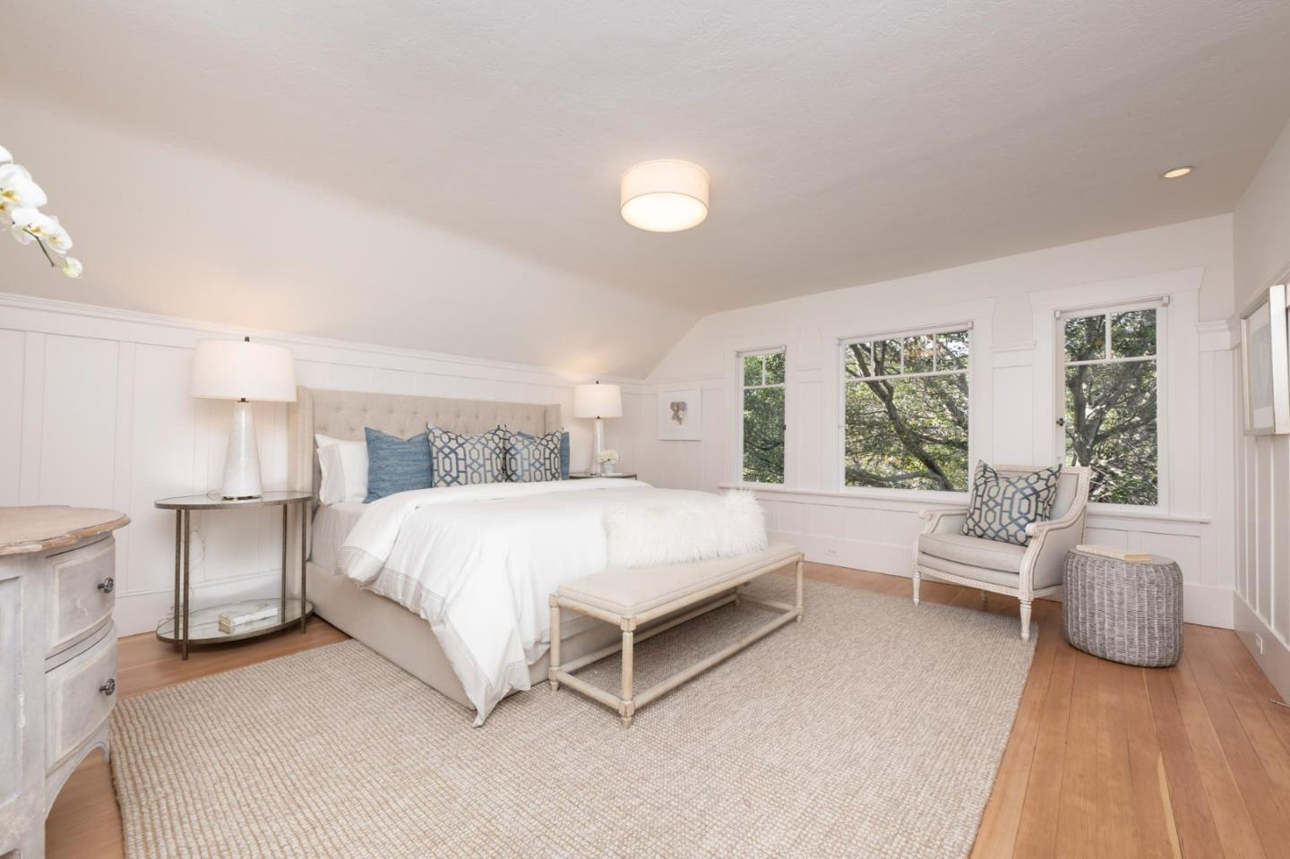 344 Occidental Avenue Burlingame, CA 94010 - Photo 15 of 27 a spacious bedroom with a bed and a couch