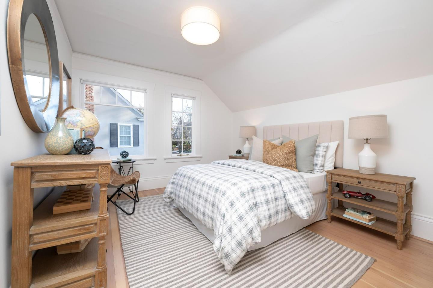 344 Occidental Avenue Burlingame, CA 94010 - Photo 17 of 27 a bedroom with a bed and wooden floor