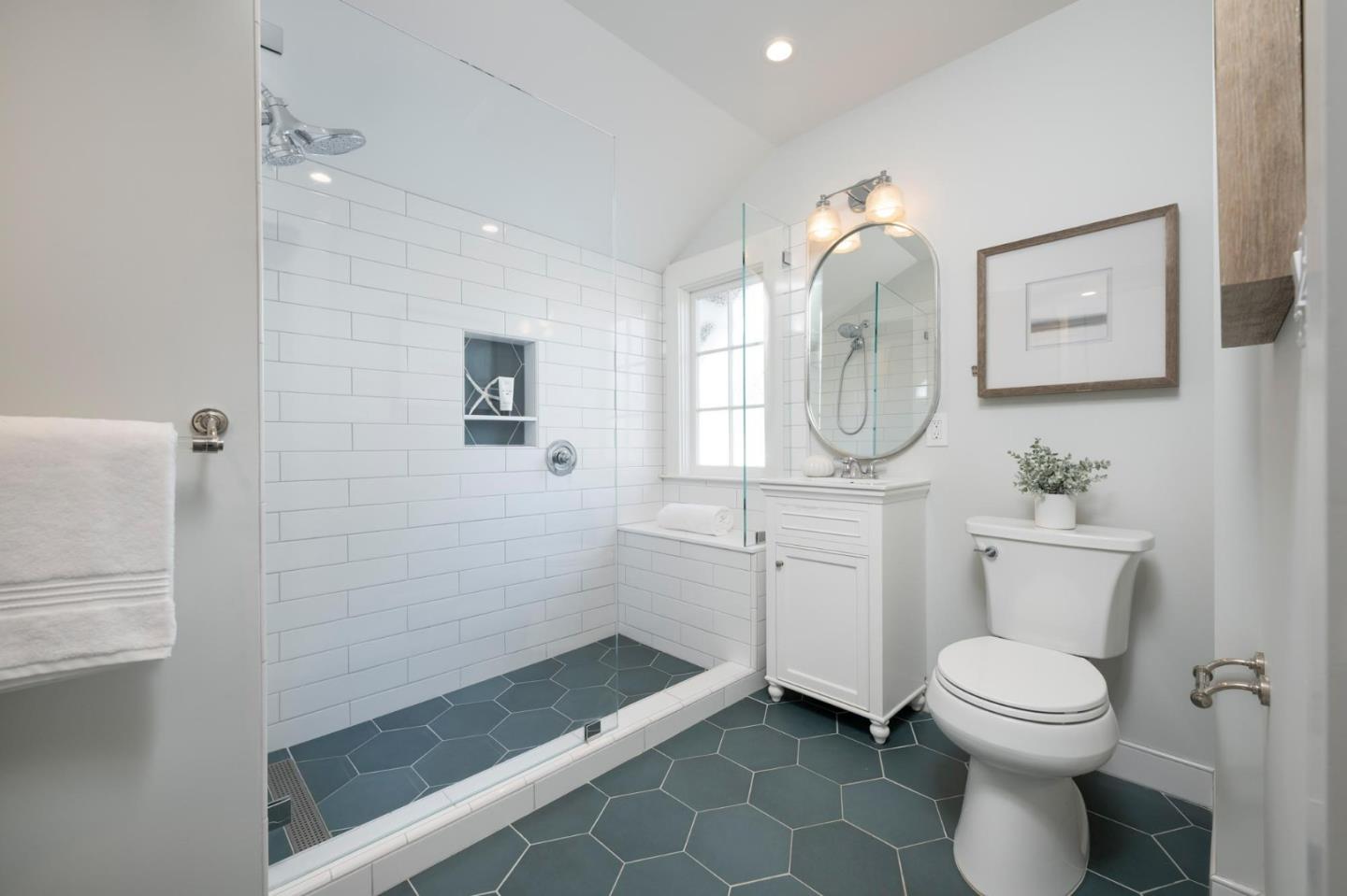 344 Occidental Avenue Burlingame, CA 94010 - Photo 18 of 27 a bathroom with a toilet a sink and mirror
