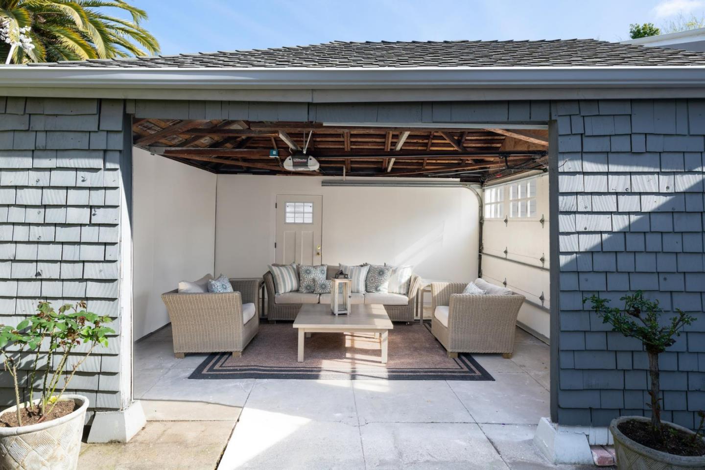 344 Occidental Avenue Burlingame, CA 94010 - Photo 21 of 27 a view of a patio with table and chairs and potted plants