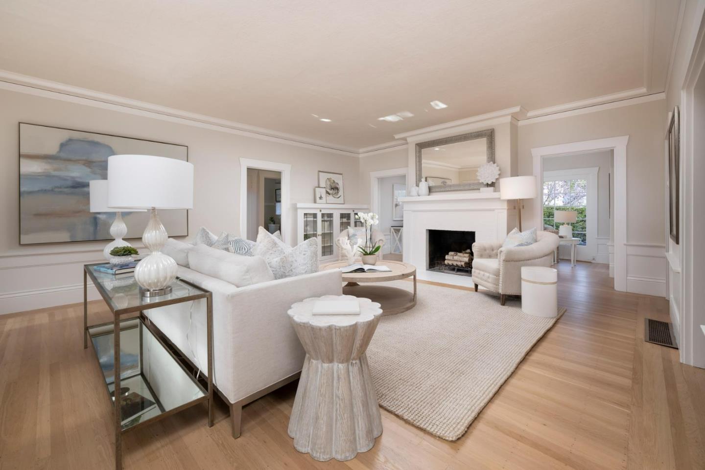 344 Occidental Avenue Burlingame, CA 94010 - Photo 4 of 27 a living room with furniture a fireplace and a table