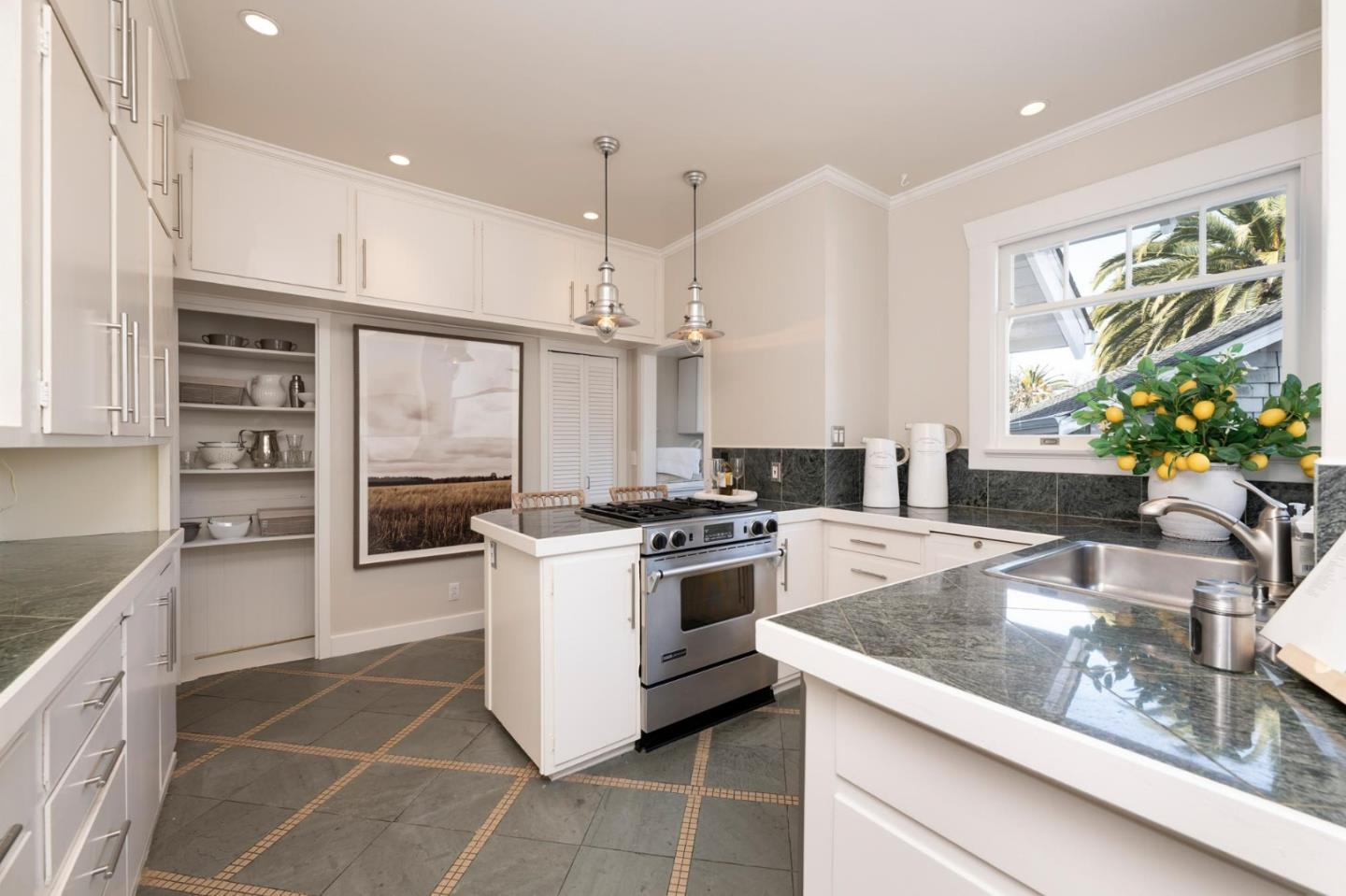 344 Occidental Avenue Burlingame, CA 94010 - Photo 10 of 27 a kitchen with a stove a sink and a refrigerator