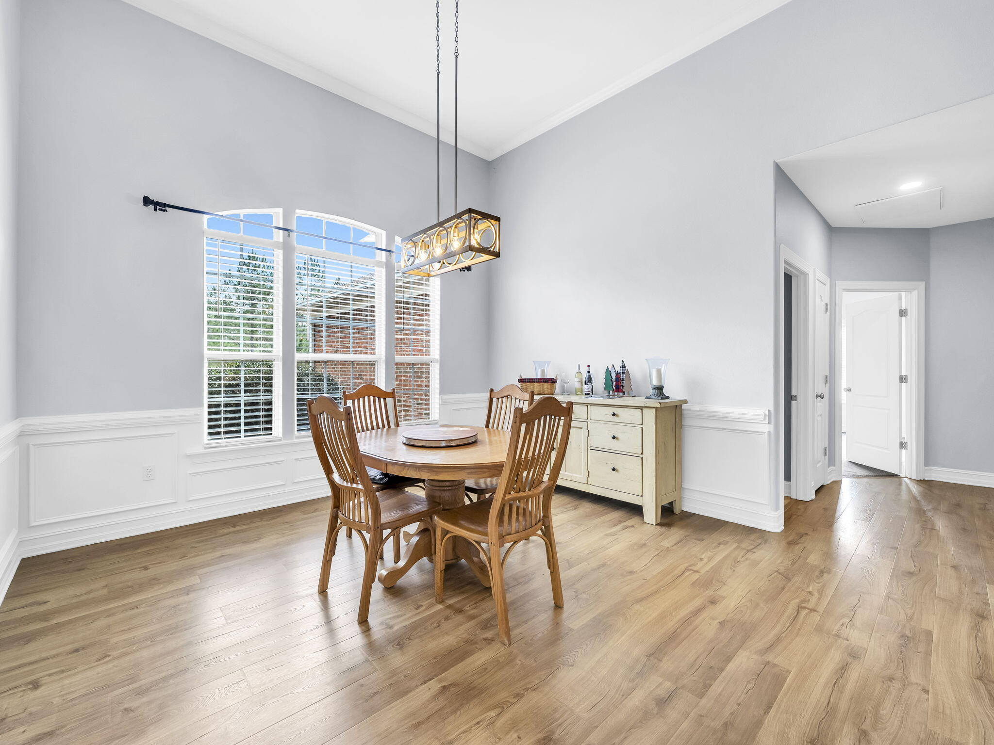 180 Gulf Pines Court Freeport, FL 32439 - Photo 14 of 70 a dining room with furniture window wooden floor