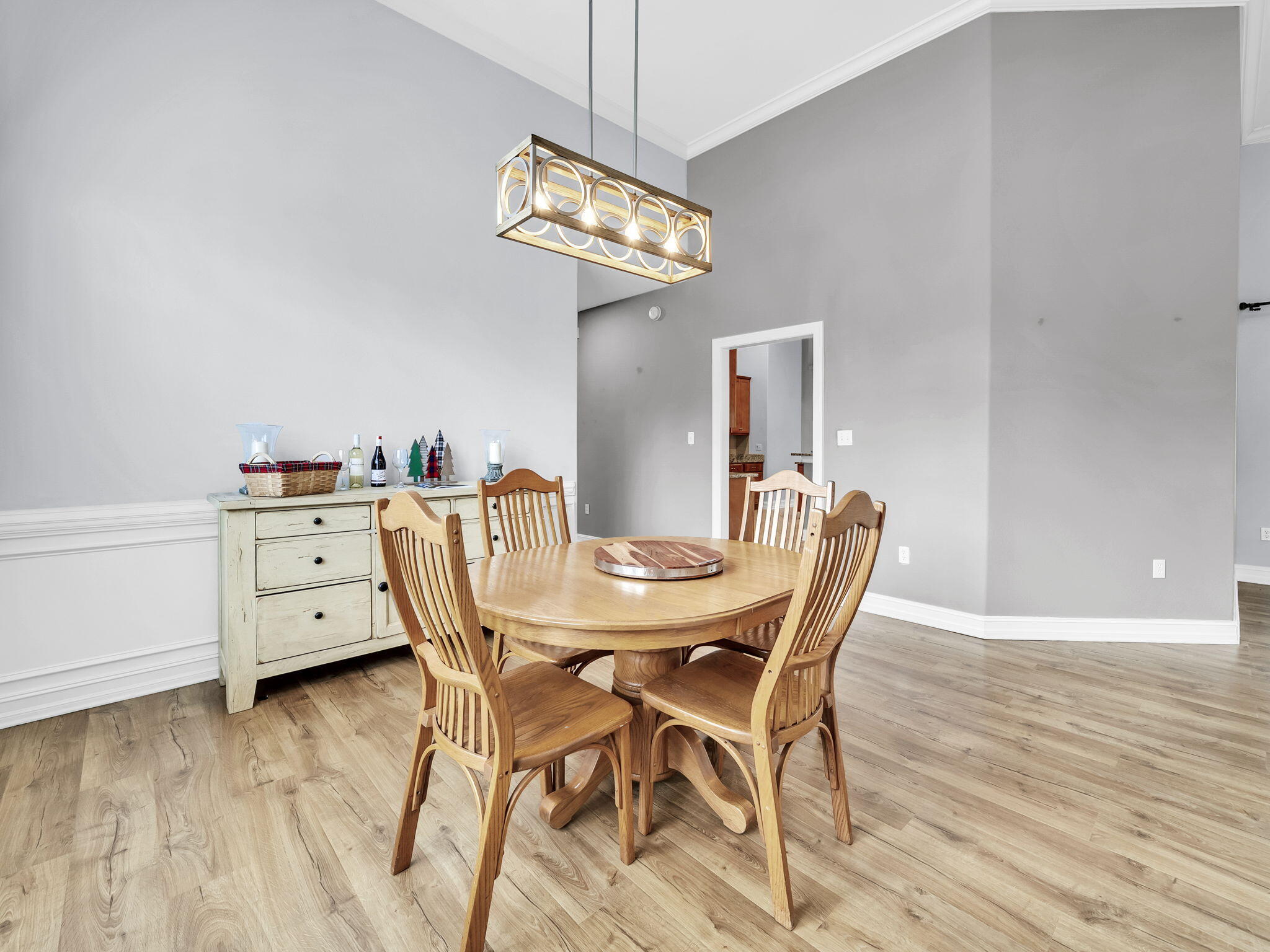 180 Gulf Pines Court Freeport, FL 32439 - Photo 16 of 70 a view of a dining room with furniture wooden floor and chandelier