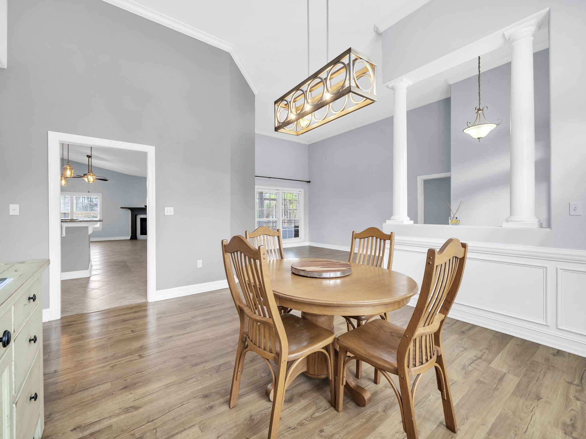 180 Gulf Pines Court Freeport, FL 32439 - Photo 17 of 70 a view of a dining room with furniture and wooden floor