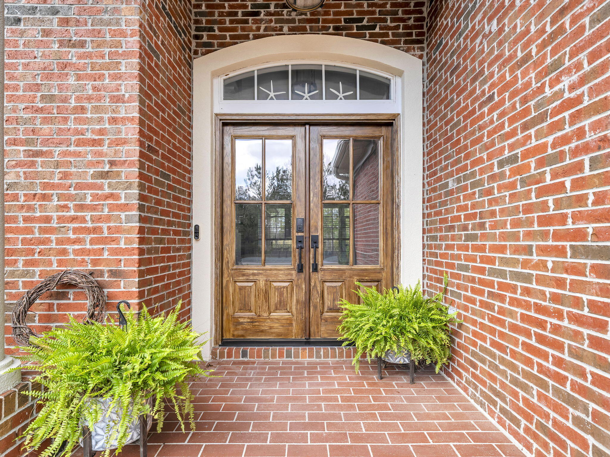 180 Gulf Pines Court Freeport, FL 32439 - Photo 3 of 70 a front view of a house with a garden