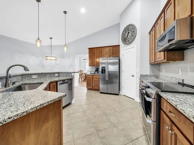an empty room with a window and a ceiling fan