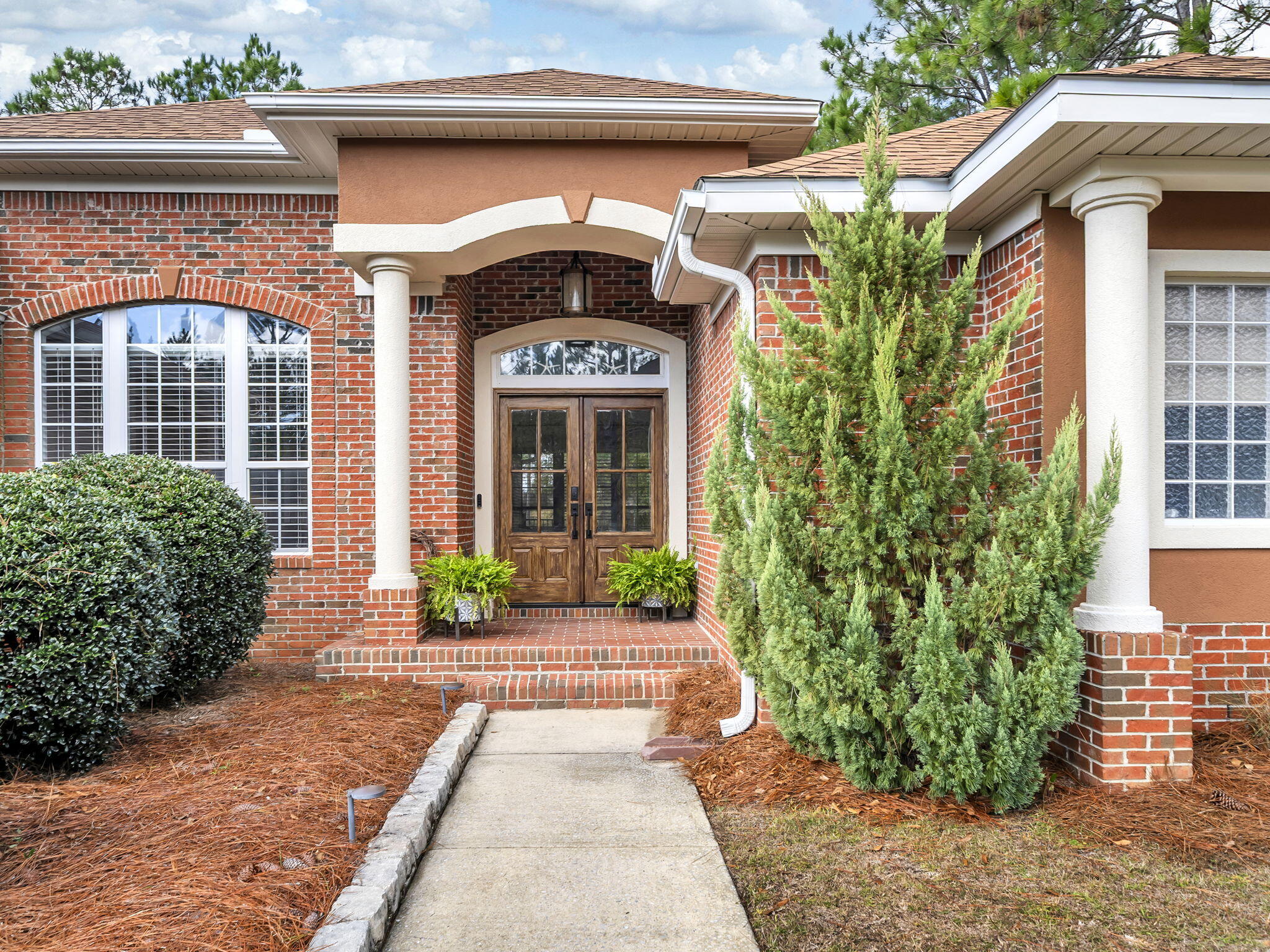 180 Gulf Pines Court Freeport, FL 32439 - Photo 4 of 70 a view of a house with potted plants