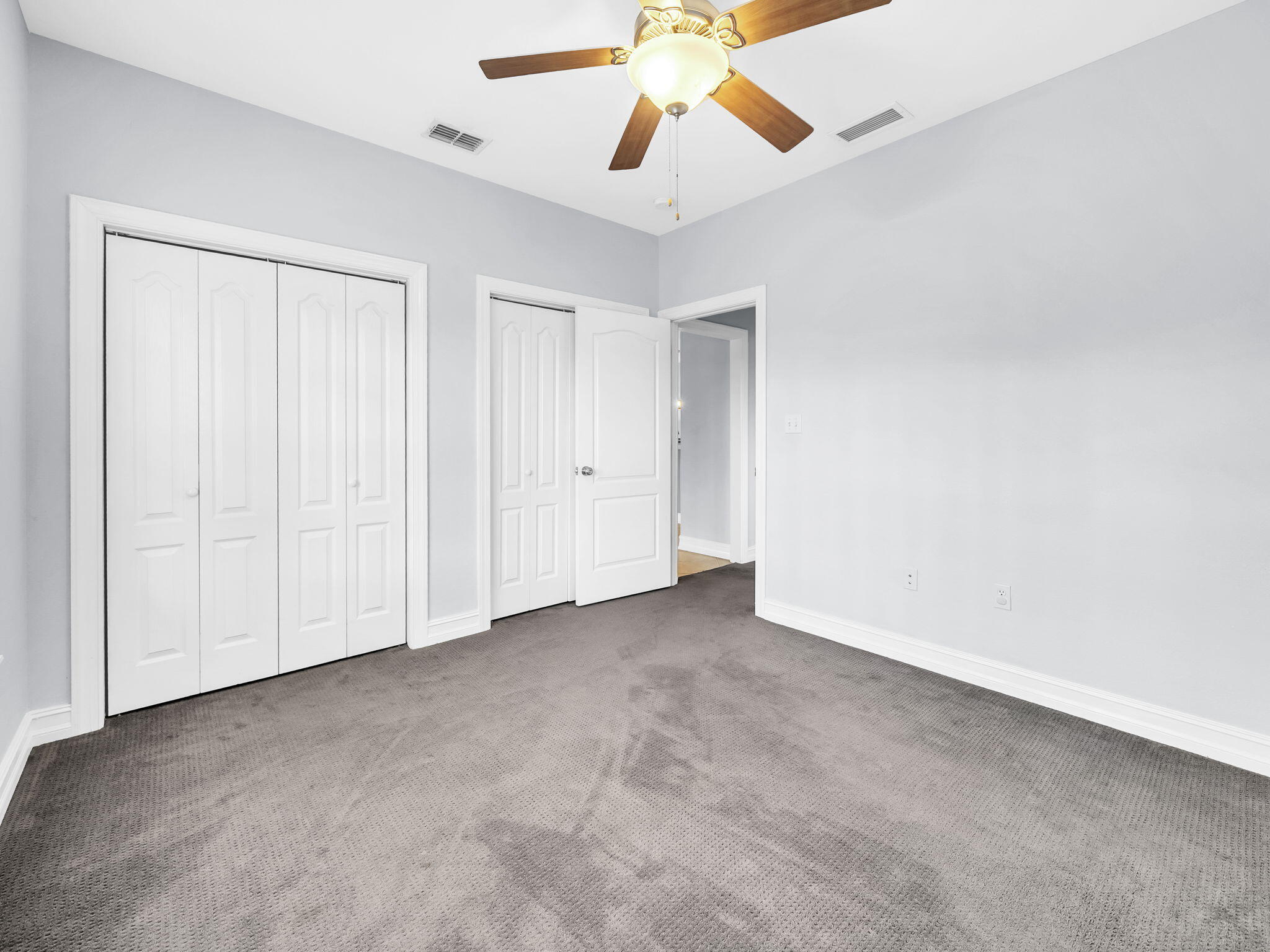 180 Gulf Pines Court Freeport, FL 32439 - Photo 41 of 70 an empty room with closet and a chandelier fan