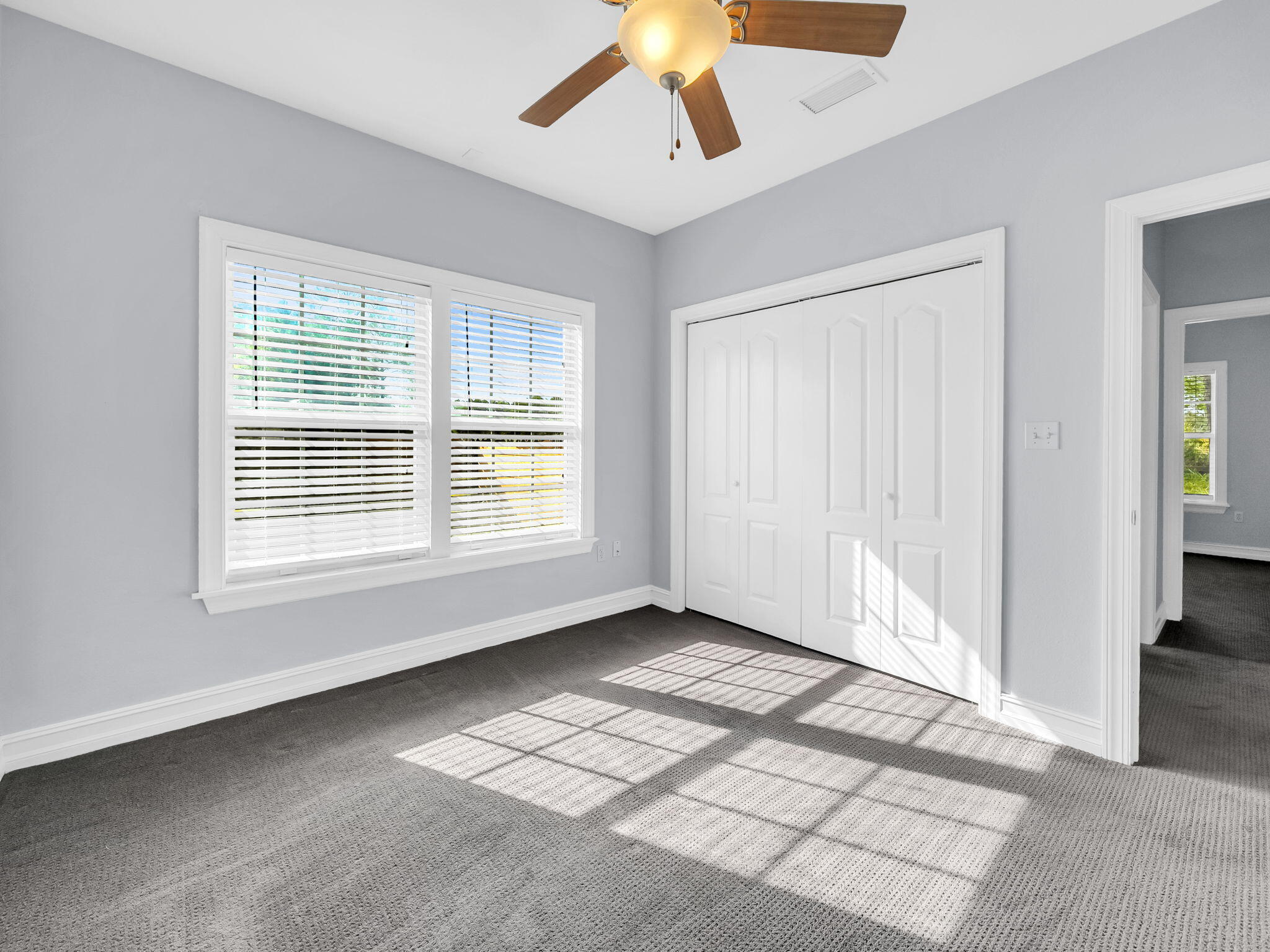 180 Gulf Pines Court Freeport, FL 32439 - Photo 44 of 70 a view of an empty room with window and a livingroom
